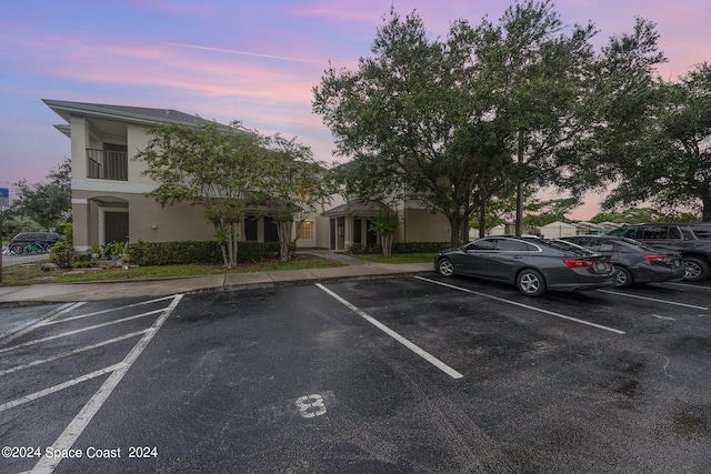 view of parking at dusk