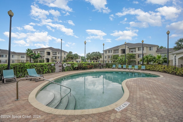 view of swimming pool featuring a patio area