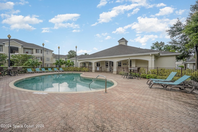 view of swimming pool featuring a patio area