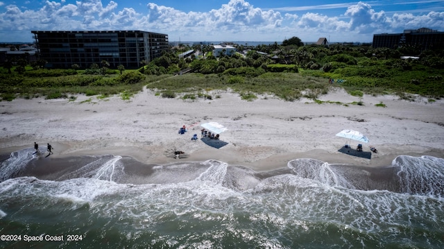 aerial view featuring a water view and a view of the beach