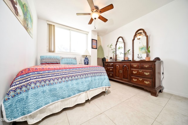 tiled bedroom with ceiling fan