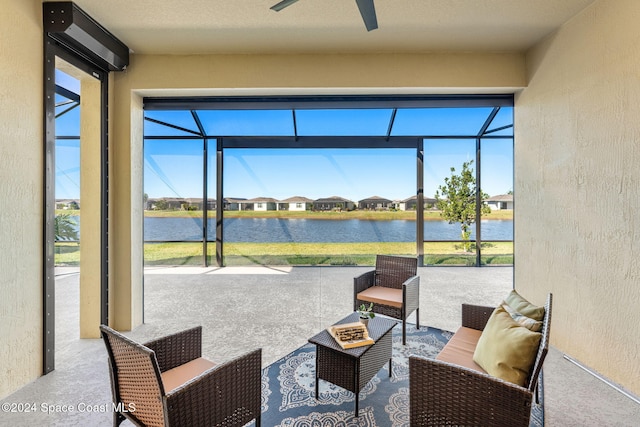 sunroom featuring a water view and plenty of natural light