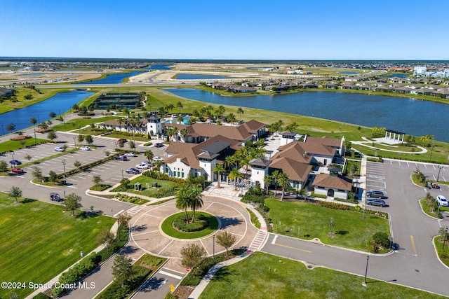 birds eye view of property with a water view