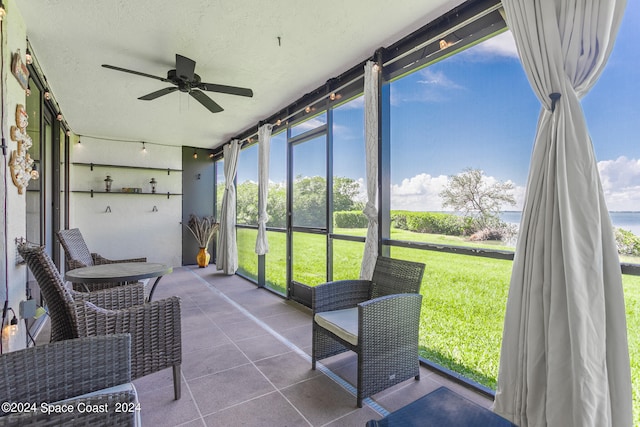 sunroom / solarium with ceiling fan