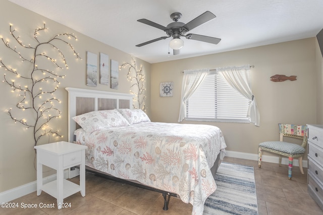 tiled bedroom with ceiling fan