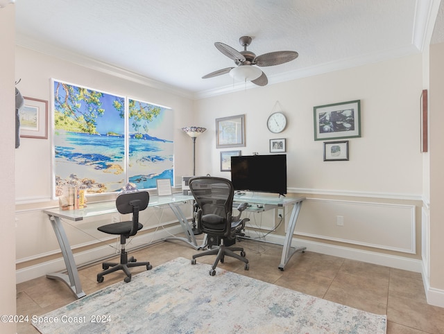 office featuring a textured ceiling, ceiling fan, and crown molding