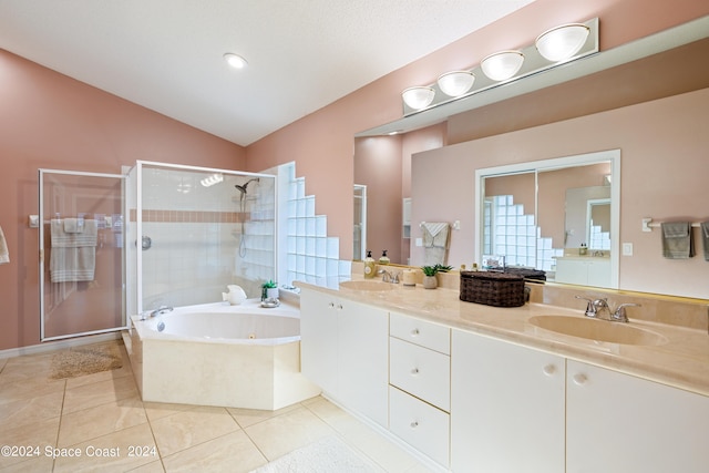 bathroom with tile patterned floors, lofted ceiling, vanity, and separate shower and tub