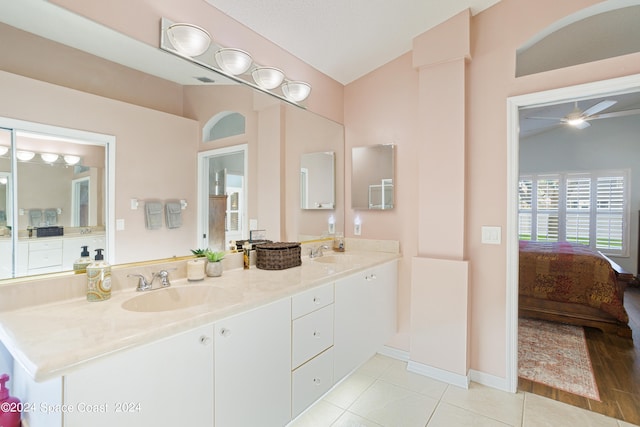 bathroom featuring lofted ceiling, vanity, ceiling fan, and hardwood / wood-style flooring