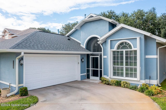 view of front of property with a garage