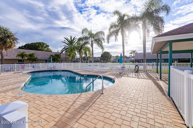 view of swimming pool featuring a patio