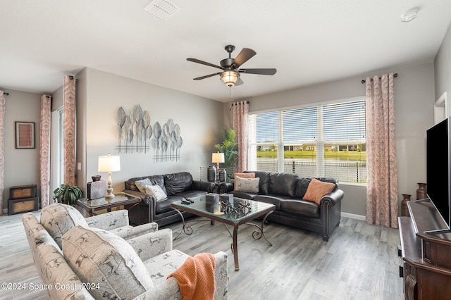 living room featuring ceiling fan and light wood-type flooring