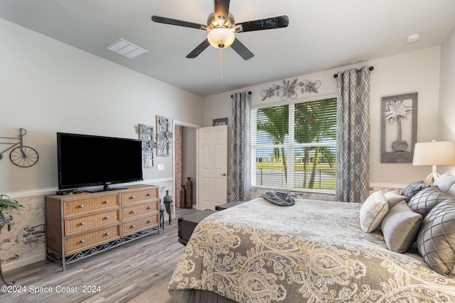 bedroom featuring wood-type flooring and ceiling fan