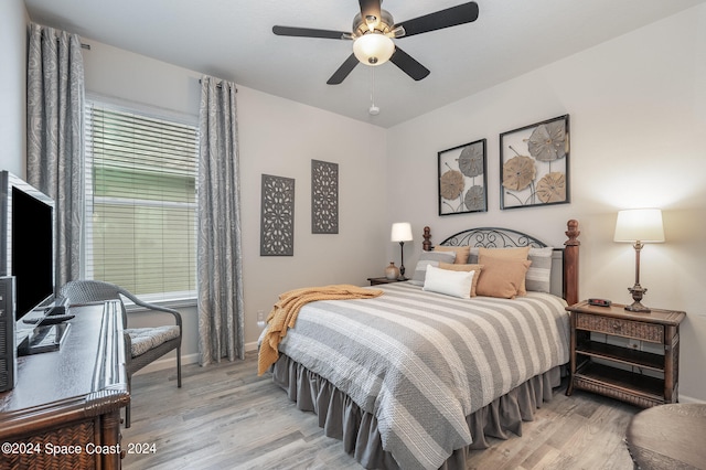 bedroom featuring light wood-type flooring and ceiling fan