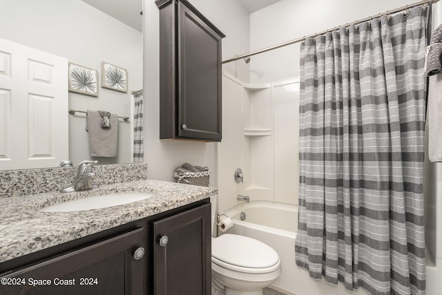 full bathroom featuring shower / bath combo, vanity, and toilet