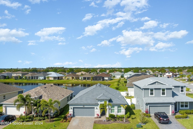 birds eye view of property featuring a water view