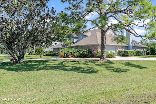 view of property exterior with a garage and a yard