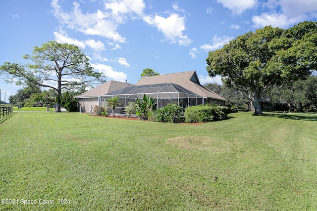 view of yard with a lanai