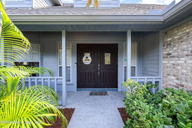 doorway to property with covered porch