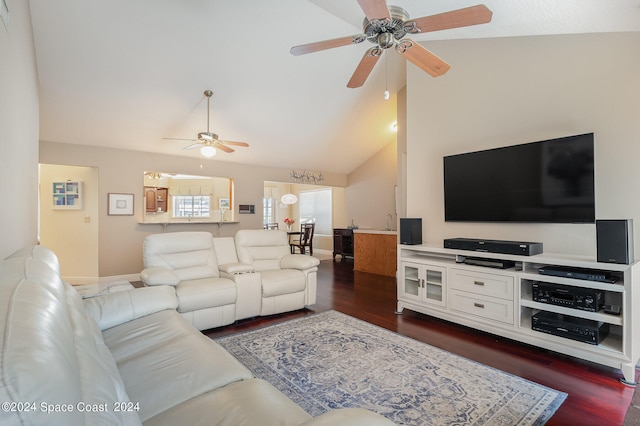 living room with ceiling fan, dark hardwood / wood-style flooring, and high vaulted ceiling