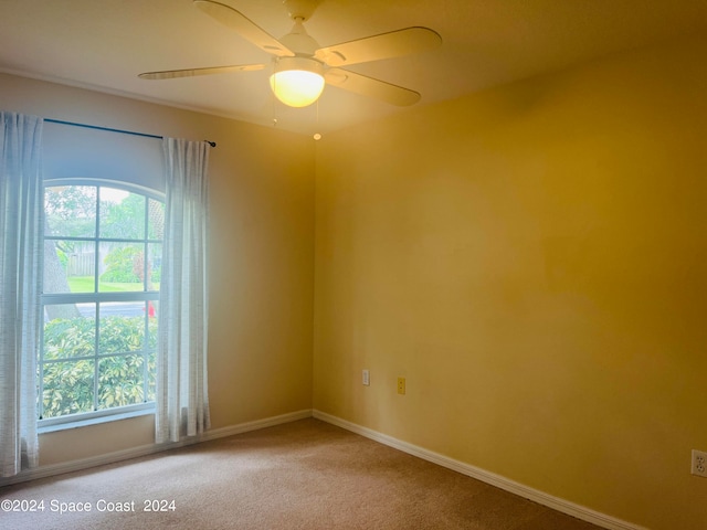 empty room with carpet and ceiling fan