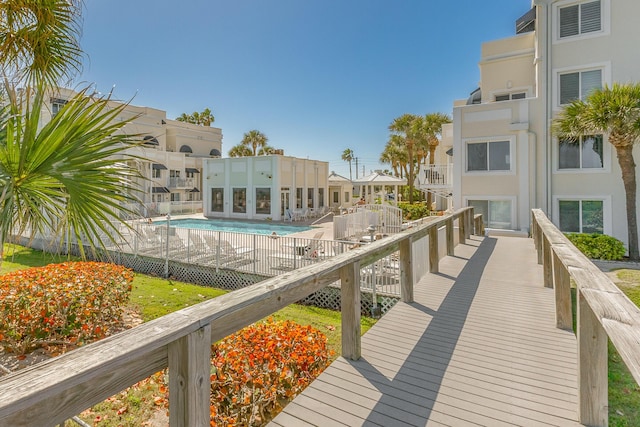 exterior space featuring a residential view and a pool