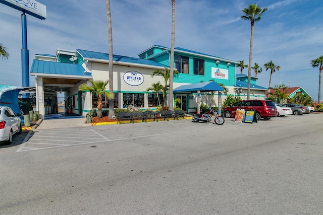 view of property with uncovered parking