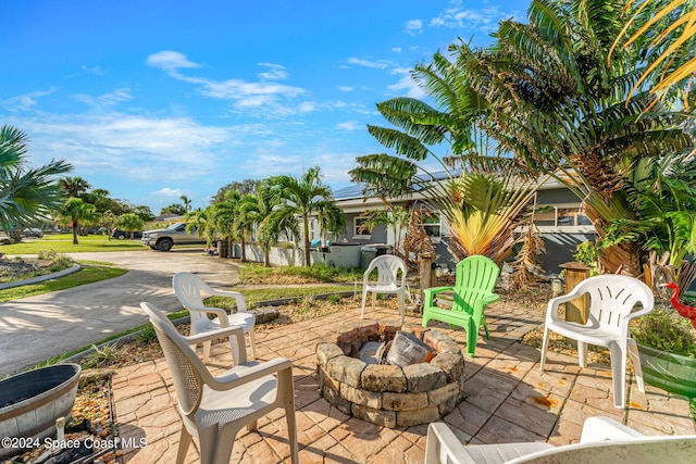 view of patio / terrace featuring an outdoor fire pit