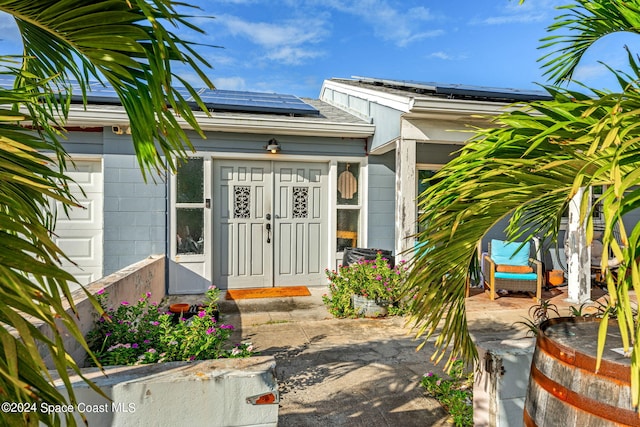 property entrance featuring solar panels