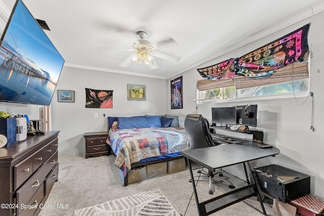 carpeted bedroom with ornamental molding and ceiling fan