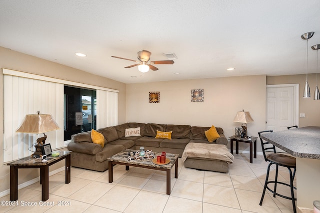 tiled living room with ceiling fan