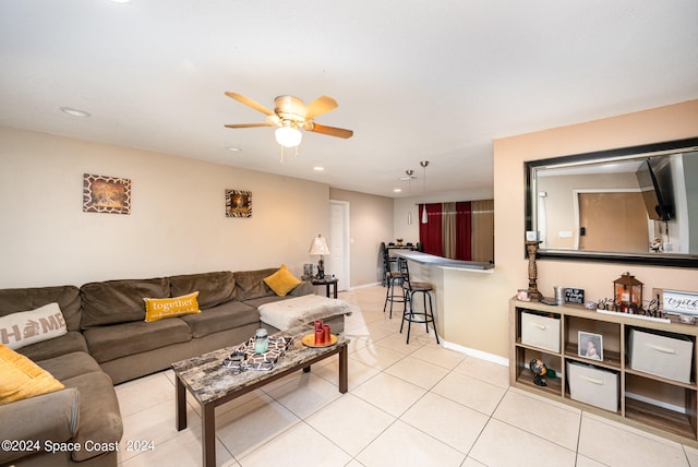 tiled living room featuring ceiling fan