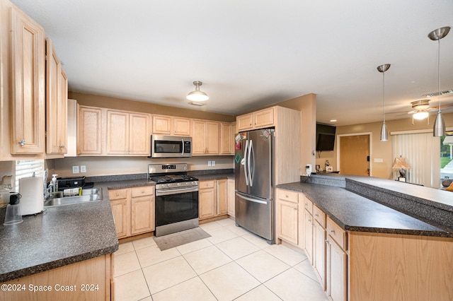 kitchen featuring kitchen peninsula, stainless steel appliances, light tile patterned floors, decorative light fixtures, and light brown cabinetry