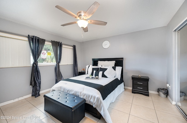 bedroom featuring ceiling fan and light tile patterned floors