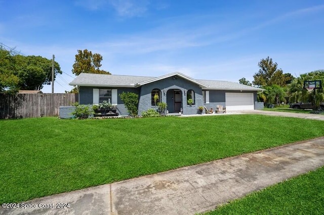 single story home with a garage and a front lawn