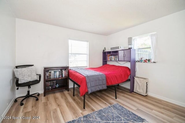 bedroom with light wood-type flooring