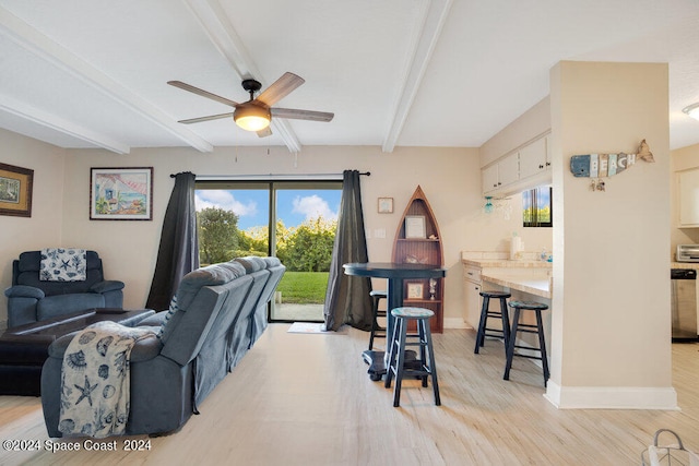 living room with ceiling fan, beam ceiling, and light hardwood / wood-style floors