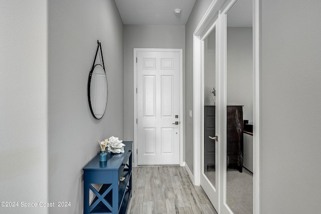 hallway featuring light hardwood / wood-style flooring