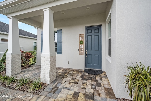 property entrance with covered porch