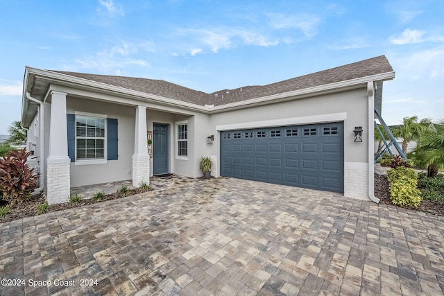 ranch-style home with a garage