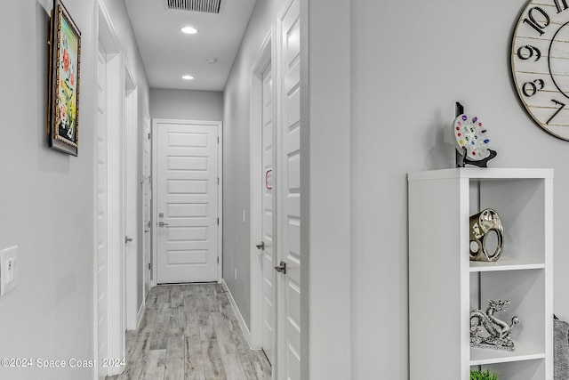 corridor featuring light hardwood / wood-style floors