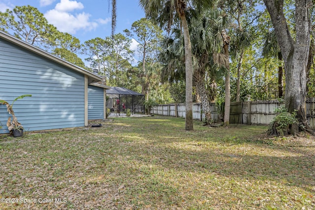 view of yard featuring a lanai