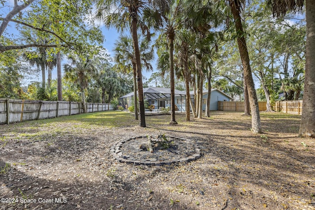 view of yard with a lanai