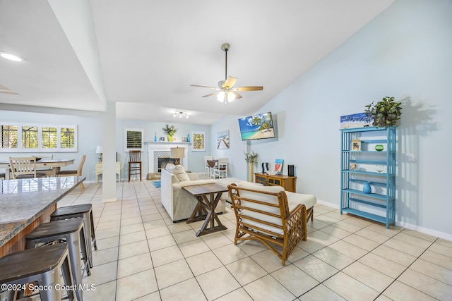 living room featuring ceiling fan and light tile patterned floors