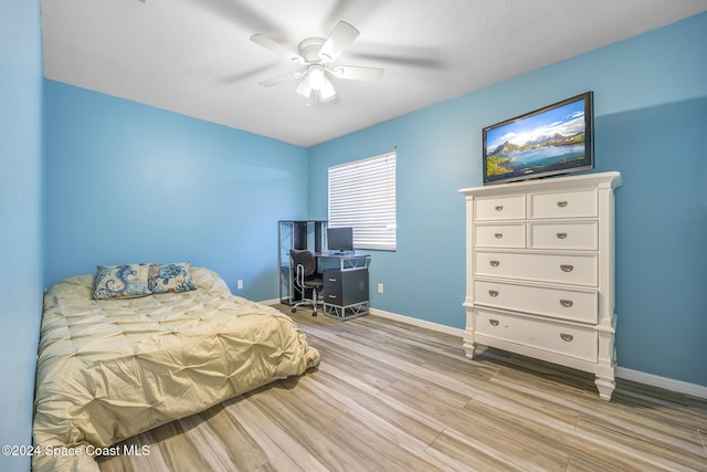 bedroom featuring ceiling fan and light hardwood / wood-style flooring