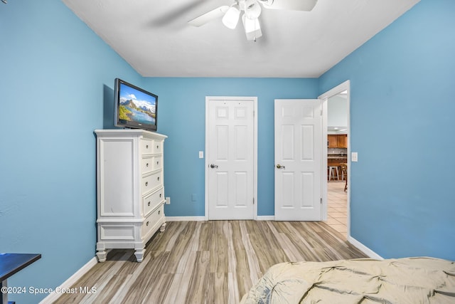 unfurnished bedroom featuring ceiling fan and light hardwood / wood-style floors