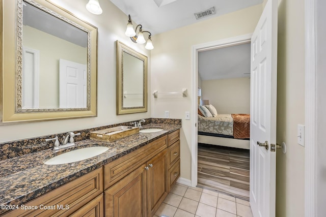 bathroom with hardwood / wood-style flooring and vanity