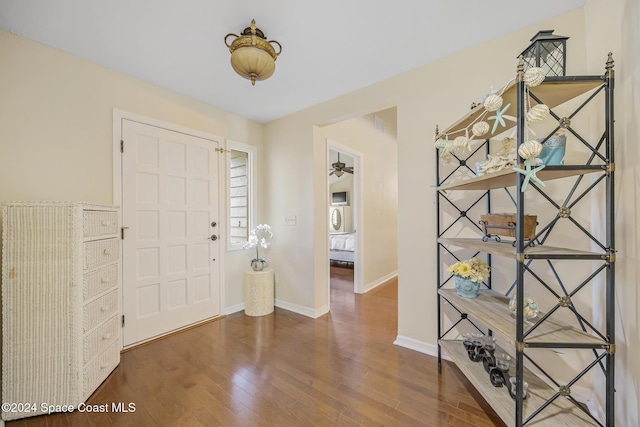 entryway with ceiling fan and dark hardwood / wood-style flooring