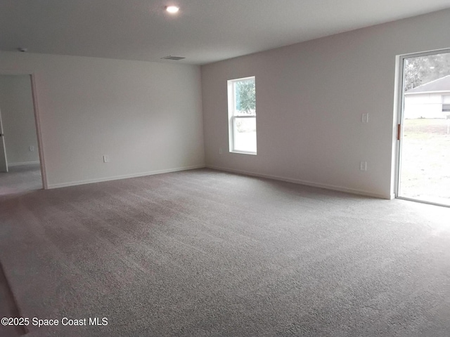 spare room featuring carpet floors