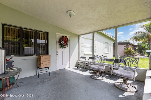 sunroom featuring vaulted ceiling