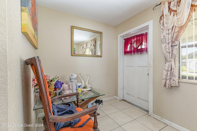 foyer featuring light tile patterned floors